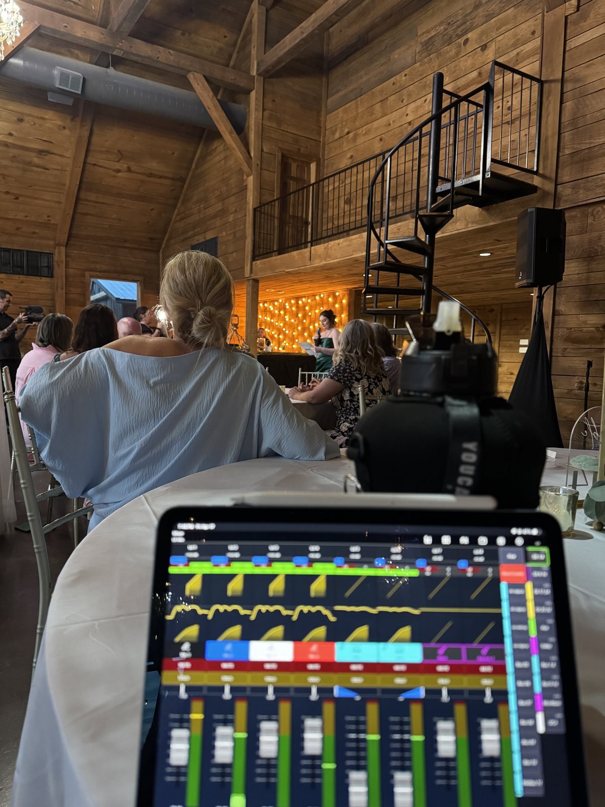Rivera Event Sound engineer running live sound from a tablet mixing console during wedding reception toasts